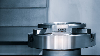 A metal object is sitting on a table. The object is shiny and metallic © Aleksandr Matveev