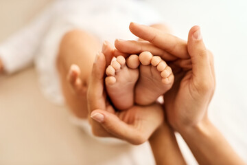 Baby, feet and mom hands for care, bonding and development with support, love and motherhood in home. Newborn, family and woman for connection, growth and nurture with protection, playing or trust