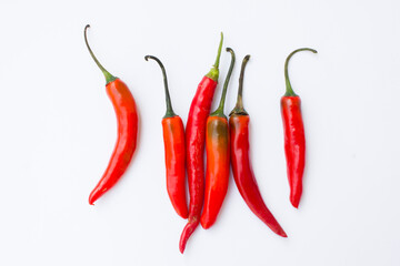 A picture of red chilies. Red chilies are high in vitamin C and beta-carotene, making them good for the skin. 