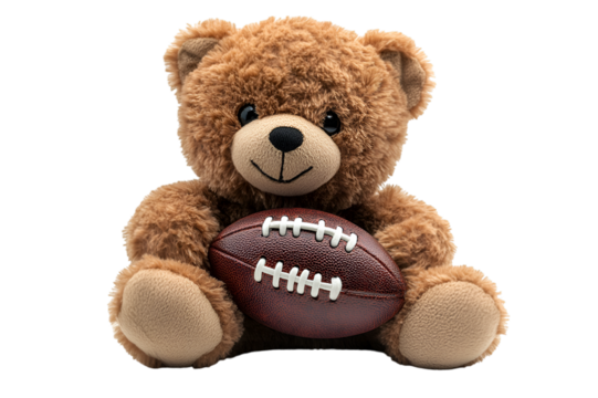 a teddy bear holding a football. 