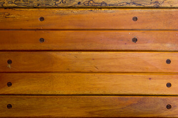 Naklejka premium A bright brown wooden background. With horizontal lines, this image is perfect for a background.