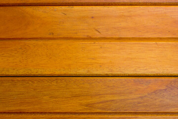 Obraz premium A bright brown wooden background. With horizontal lines, this image is perfect for a background.