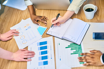 Hands, business people and team planning with data, stats and documents for risk management. Closeup, chart and group with graph, analysis and financial metrics for investment performance in office