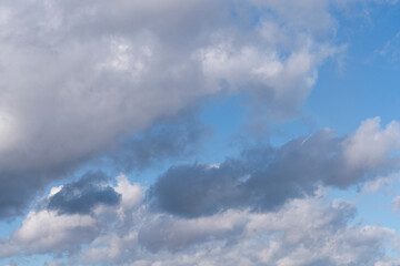 Breathtaking View of Serene Clouds Drifting Across Vibrant Blue Sky on Sunny Afternoon