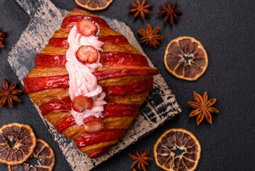 Crispy sweet red croissant with strawberry filling