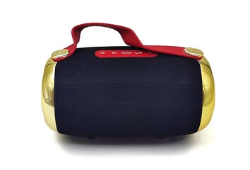 Photo of a wireless, cylindrical portable bluetooth speaker, isolated on white background.