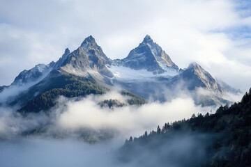 Majestic peaks enveloped by foggy skies in breathtaking alpine landscape