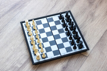 An elegant chess board featuring white and black pieces positioned on it