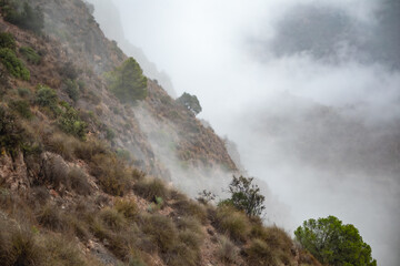Lunar Landscape in El Valle Regional Park in Murcia, Murcia Region, Spain with clouds after rain