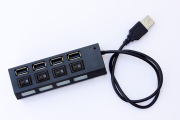 A black multiport USB hub is a device that allows you to connect multiple USB devices to a single...