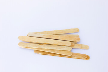 Ice cream sticks, also known as popsicle sticks, are typically made from wood and used for crafting, cooking, and as a handle for ice cream or popsicles.
