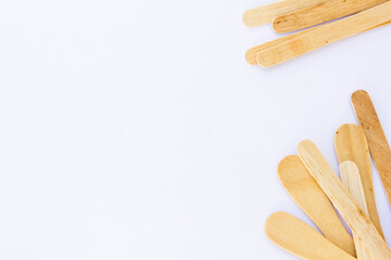 Ice cream sticks, also known as popsicle sticks, are typically made from wood and used for crafting, cooking, and as a handle for ice cream or popsicles.