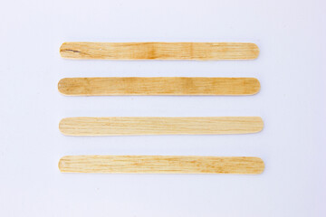 Ice cream sticks, also known as popsicle sticks, are typically made from wood and used for crafting, cooking, and as a handle for ice cream or popsicles.