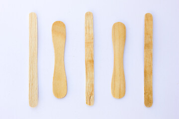 Ice cream sticks, also known as popsicle sticks, are typically made from wood and used for crafting, cooking, and as a handle for ice cream or popsicles.