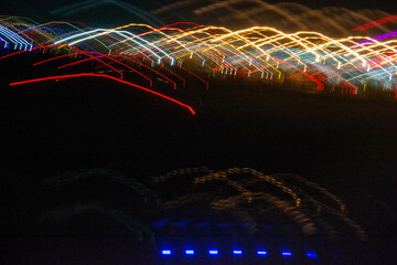 Abstract blurry background with pattern from colorful traces or trajectory of lights.Abstract colourful light pattern long exposure. High quality photo