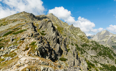 Ridge trail leading to Slavkovsky peak (Slavkovsky stit) in autumn colours. Tatra Mountains.