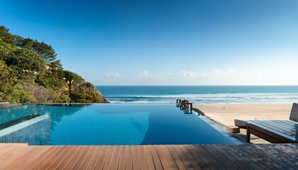 Obraz premium Beach resort with infinity pool overlooking ocean.