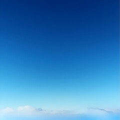 Fototapeta premium A stunning view of a clear blue sky with wispy clouds at the horizon.