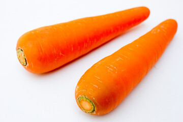 The carrot, scientifically known as Daucus carota subsp. sativus, is a root vegetable that belongs to the family Apiaceae. The plant can grow up to 30-60 cm tall, with feather-like green leaves. The t