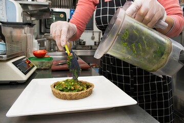 WORLD FOOD DAY. Hands, cutting board and salad in kitchen with green vegetables for healthy food or nutrition. Culinary skills for cooking lunch with lettuce, cucumber and organic ingredients at home.