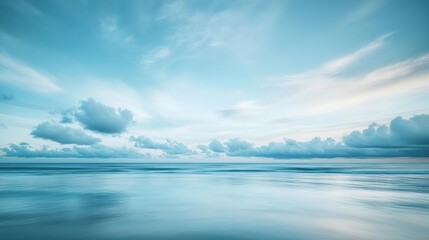 Bright sky with fluffy white clouds floating against a light blue backdrop