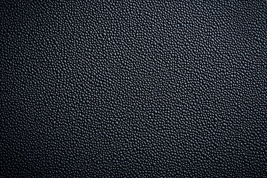A neoprene texture background features a smooth, slightly glossy surface with a subtle, durable feel