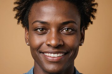 Obraz premium Full framed very close face portrait of a smiling 40s african non binary with hazel eyes looking at the camera, studio shot,hazel background.