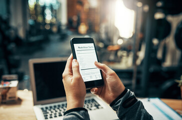 Hands, phone and online screen in gym with information for healthy eating, nutrition and fitness...