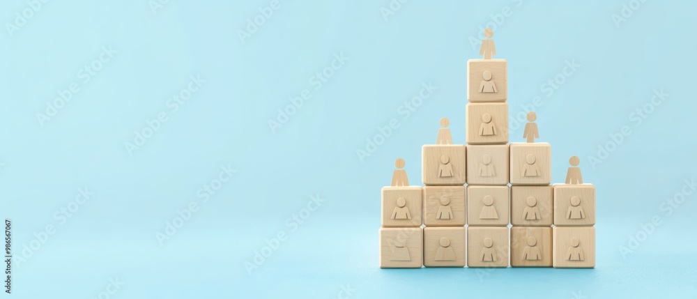 Wall mural wooden figures stacked in pyramid shape representing hierarchy or leadership