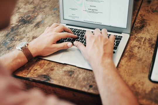 Hands, typing and screen of laptop, desk and resume writer in on cafe, professional and creative. Digital, editing and help to job seekers, qualification and business of entrepreneur, above or person