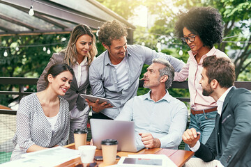 Cafe, business people and laptop with tablet for discussion, research and planning for creative startup. Career, collaboration and design team with digital for social media page, website and review