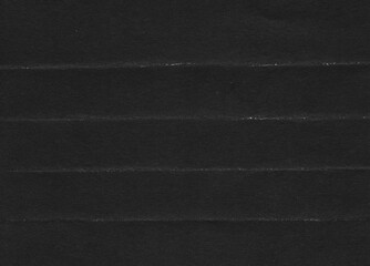 Fototapeta premium Folded paper black grunge texture with worn, rubbed and torn effect, old retro 90s texture for greeting cards, posters, web landings and other artworks