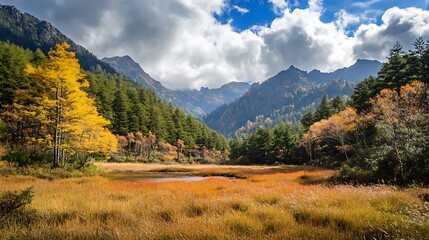 Obraz premium Stunning mountain landscape with autumn colors and blue sky, a perfect nature background.