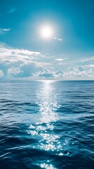Fototapeta premium Tranquil Blue Ocean with Sun Glimmering on Water Surface