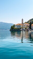 Naklejka premium Tranquil coastal village with church steeple and turquoise water