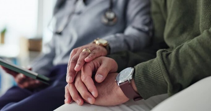 Doctor, patient and holding hands with tablet and support for man with cancer news and diagnosis. Telehealth, clinic and healthcare consultant with empathy and care with medical advice and results