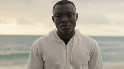 Close-up of an  athlete in sportswear against the sea, active lifestyle, training and healthy...