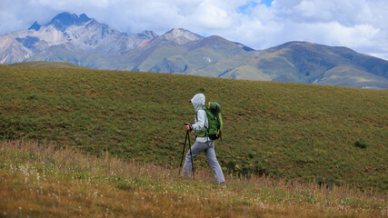 Fototapeta premium Woman hiking on high altitude mountain top