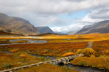 A wooden bridge at Kungsleden hiking trail near Salka, Lapland, Sweden