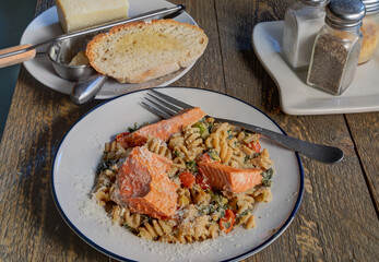 Side view of salmon  pasta dish