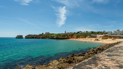 The stunning Praia dos Arrifes in Portugal's Algarve showcases turquoise waters, golden sands, and...