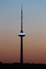 Illuminated Tower at Dusk with Blue Lights