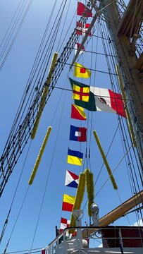 Nautical flags on a Mexican ships, masts and sails in sight