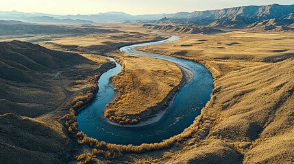 Aerial View of a Winding River Through a Dry, Hilly Landscape