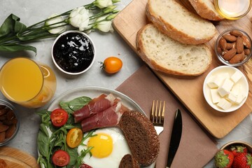 Different tasty food served for brunch on grey marble table, flat lay