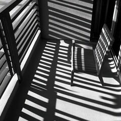 Naklejka premium Stripes of Light: A minimalist balcony bathed in the soft glow of sunlight, casting a captivating pattern of parallel lines across the floor. The interplay of light and shadow evokes a sense of tranqu