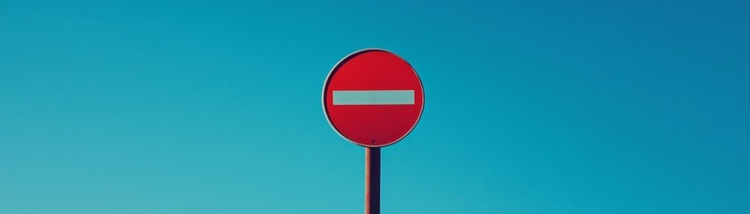 Red No Entry Sign Against Blue Sky
