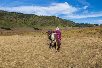 A man of Tengger tribe works as tourist guide around Bromo Mountain. 