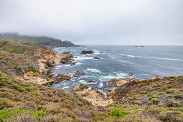 Beautiful landscape of Pacific Ocean coast along Highway 1 and Big Sur, aerial view, sunset, sunrise, fog. Concept, travel, vacation, weekend
