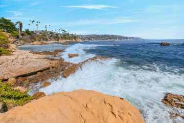 Beautiful landscape of Laguna Beach ocean coastline with palm trees in Treasure Island Park, Orange County, California, USA